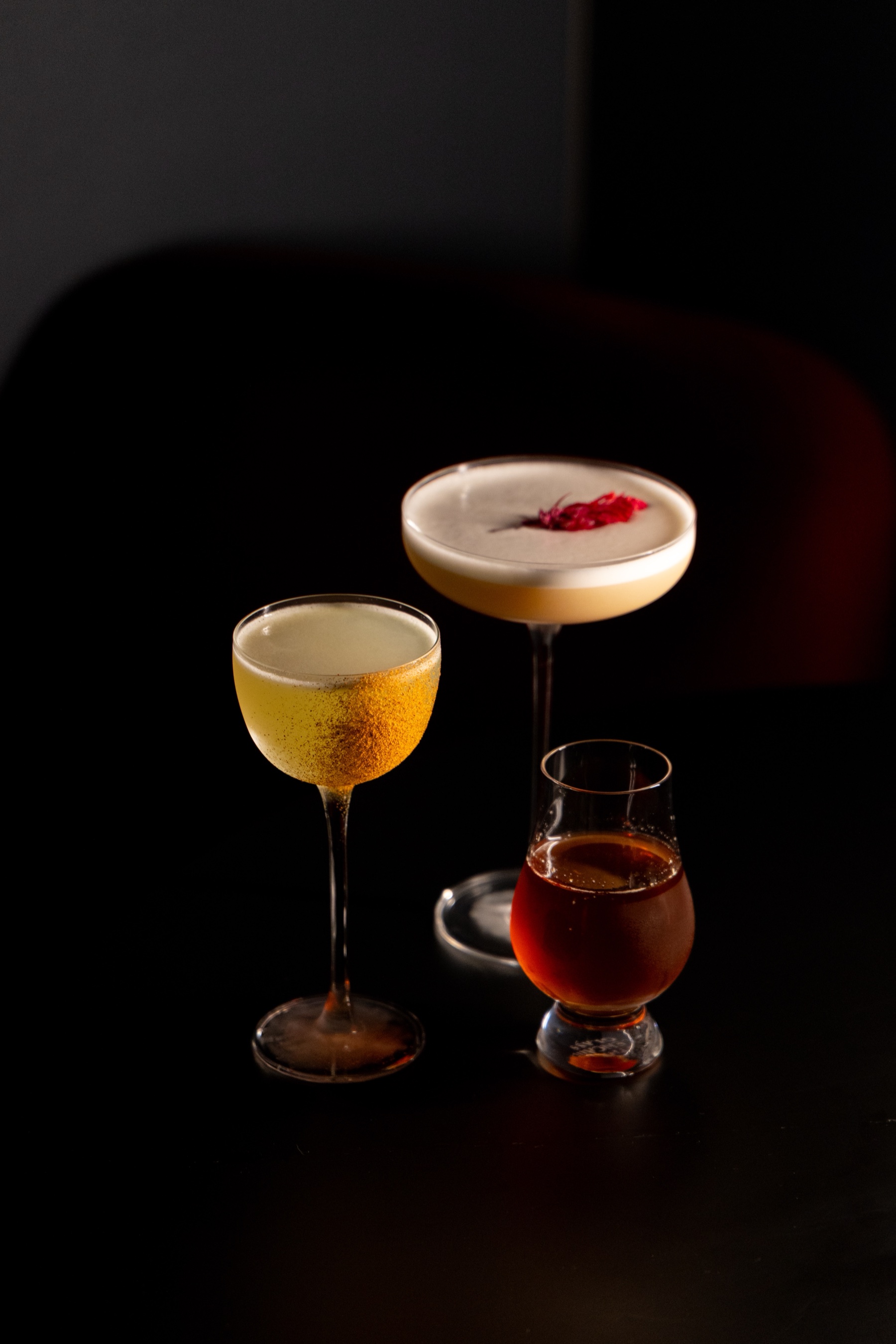 Three CHITORI cocktails on a dark table