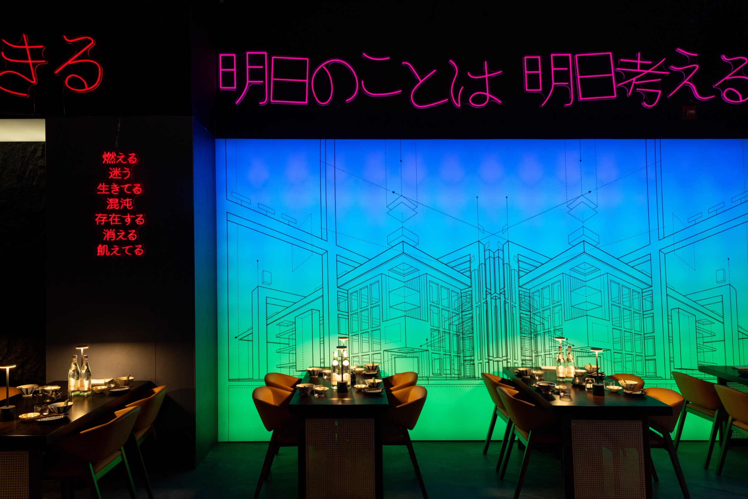 CHITORI dining room with neon Japanese signs and blue-green light
