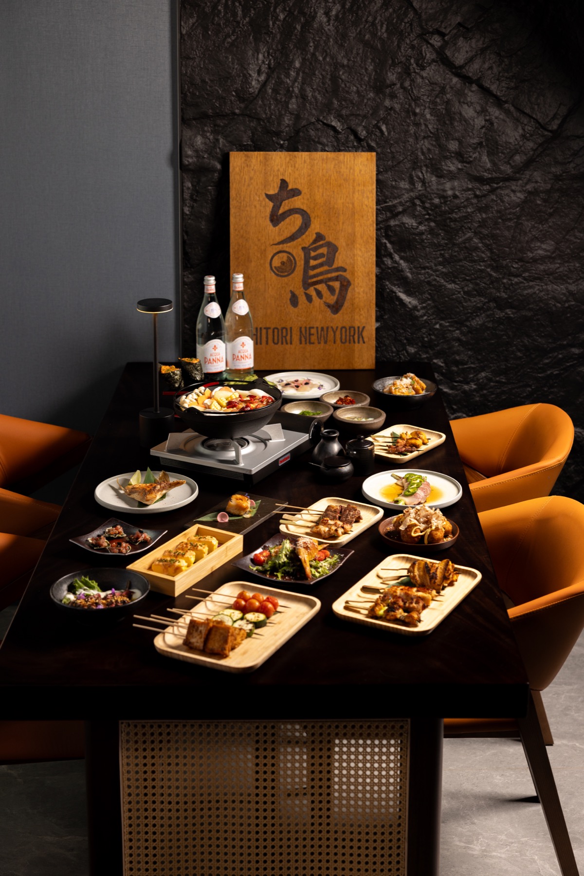 CHITORI dining table with food spread and restaurant sign